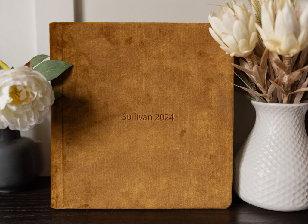 Family photo album on a shelf.