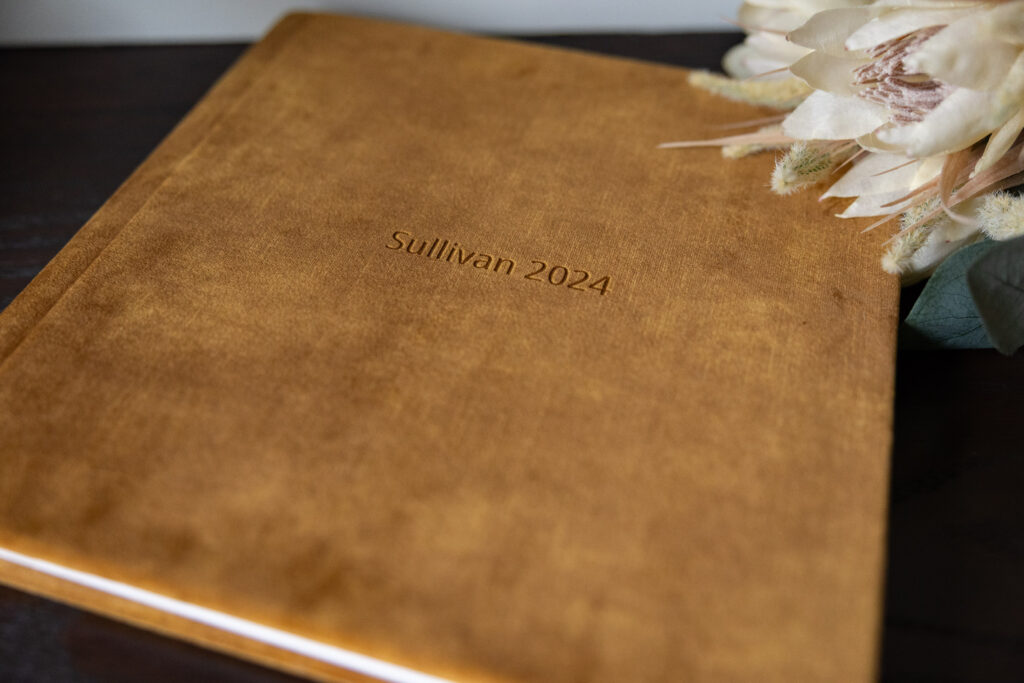 Close up of a beautiful velvet photo album with embossed print.