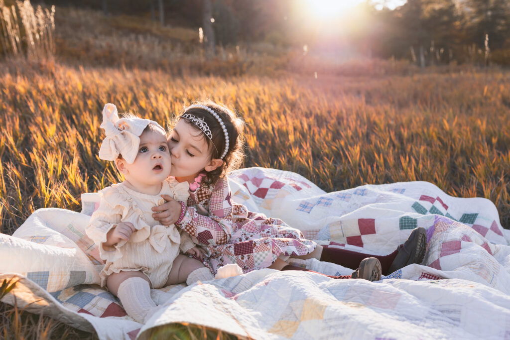 Two young children on a blanket at a beautiful photography location in Colorado Springs.