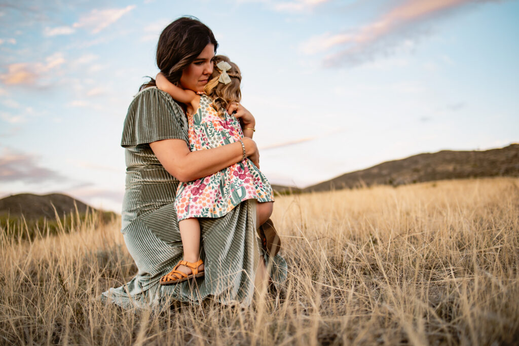Mother holding her daughter during photo session near Colorado Springs.